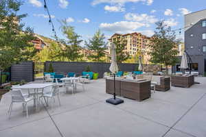 View of patio featuring outdoor dining space and an outdoor hangout area