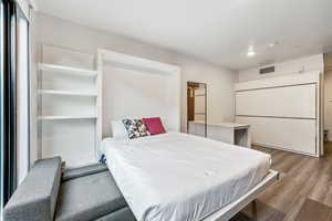 Bedroom featuring wood finished floors and recessed lighting