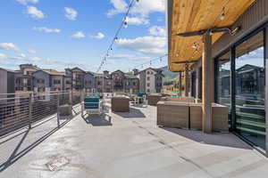 View of patio with a residential view and an outdoor living space