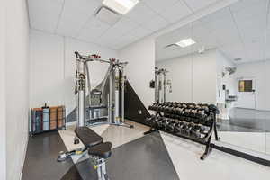 Workout room with a paneled ceiling