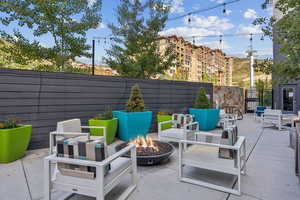 View of patio / terrace featuring an outdoor living space with a fire pit