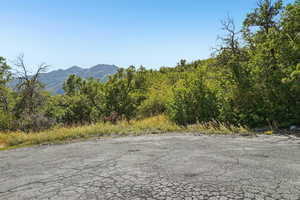 View of asphalt road featuring a mountain view