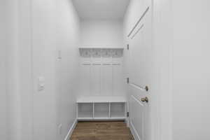 Mudroom with dark wood-style flooring