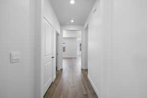 Hall featuring recessed lighting and dark wood finished floors