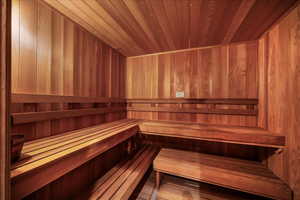 Sauna / steam room with wooden ceiling and wood walls