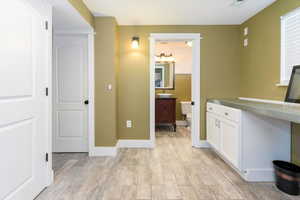 Bathroom with vanity and light wood-type flooring