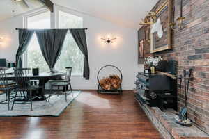 Dining room featuring dark wood-style flooring