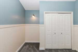 Bedroom with loft/play space and ceiling fan