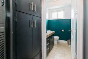 Bathroom with vanity and light tile patterned floors