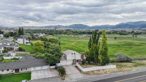 View of mountain background featuring rural landscape