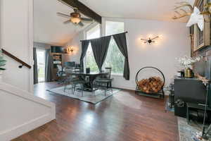 Dining room with healthy amount of natural light, dark wood-type flooring, and a ceiling fan