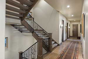 Stairs featuring recessed lighting and baseboards