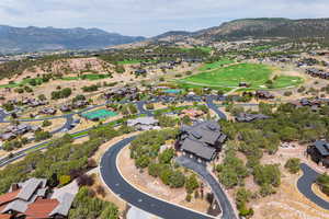 Aerial view of property's location with mountains and nearby suburban area