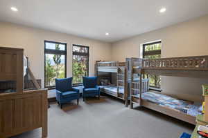 Carpeted bedroom with recessed lighting