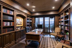 Office area with built in features, crown molding, dark wood-style flooring, and recessed lighting