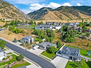 Aerial perspective of suburban area featuring a mountain backdrop