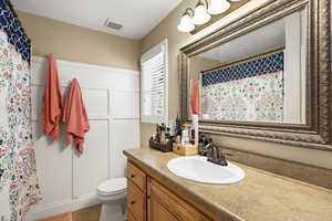 Full bath with vanity and a shower stall