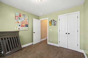 Bedroom with carpet floors and a closet