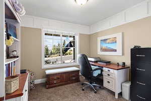 Office featuring dark colored carpet