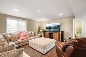 Living area featuring carpet floors and recessed lighting