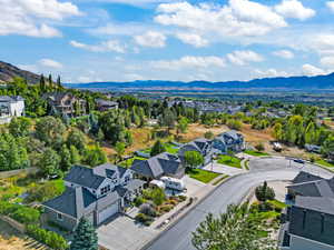 Aerial view of residential area featuring a mountain backdrop