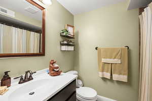 Bathroom with vanity and a shower with curtain