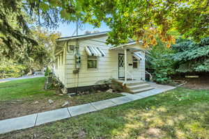 Bungalow-style house with a front lawn
