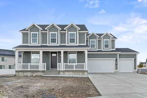 View of front of home featuring concrete driveway, a porch, an attached garage, and a shingled roof