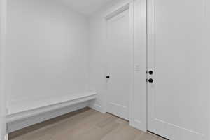 Mudroom featuring light wood-style floors
