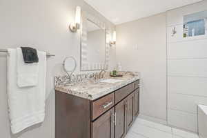 Bathroom with vanity and tile patterned floors