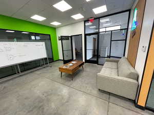 Common area with a paneled ceiling