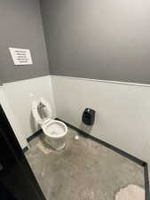 Bathroom with toilet and baseboards