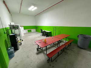 Misc room featuring unfinished concrete flooring