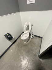 Bathroom view of a surveillance system and unfinished concrete floors