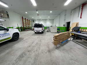 Garage featuring a heating unit