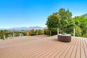 Wooden deck featuring a mountain view