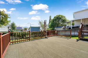 Wooden deck featuring a fenced backyard and a residential view