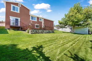 Rear view of house with stucco siding
