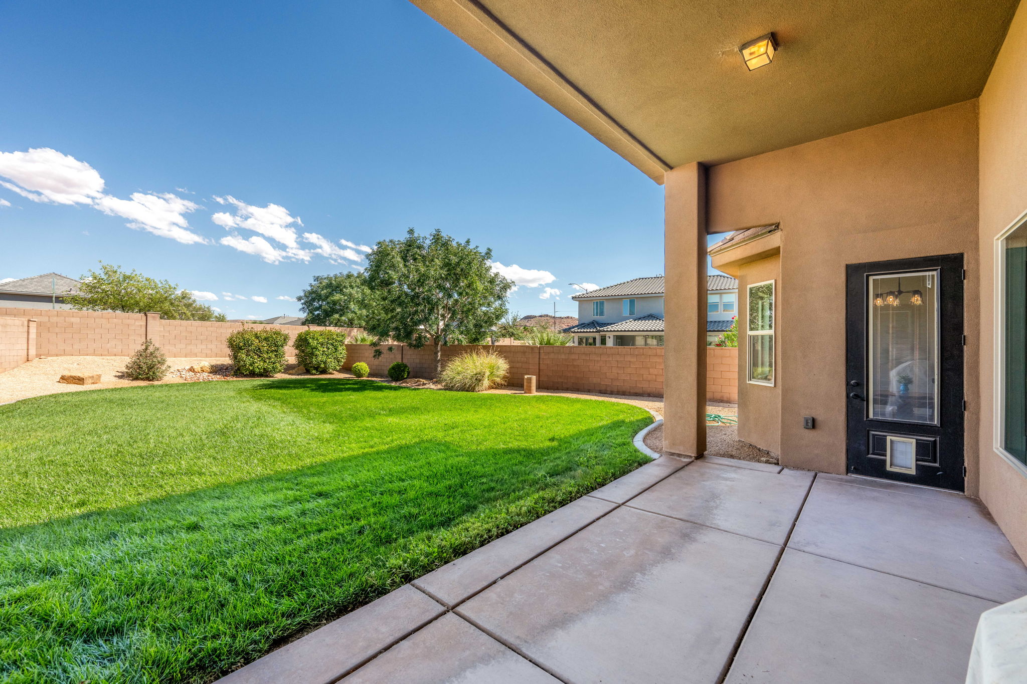 Fenced backyard featuring a patio area