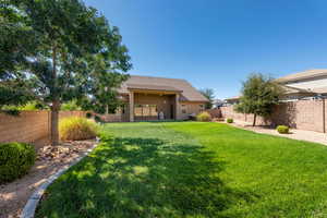 Back of house with a fenced backyard, a patio, and stucco siding