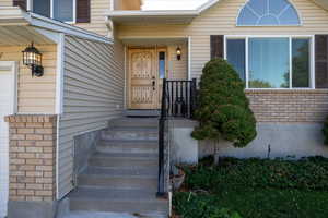 View of exterior entry featuring a garage