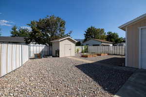 Fenced backyard with a shed