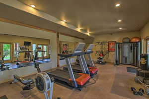 Exercise room featuring recessed lighting