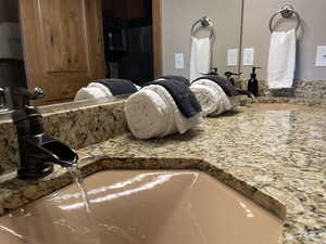 Bathroom view of vanity and built in microwave