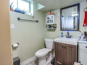 Bathroom featuring vanity and toilet