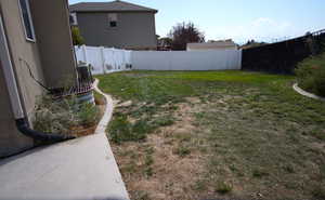 View of fenced backyard
