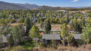 Aerial view of property's location featuring mountains