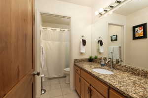 Bathroom featuring vanity and light tile patterned flooring