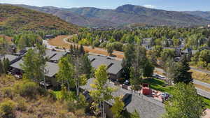 Aerial perspective of suburban area with a mountain backdrop