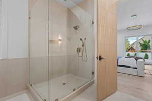 Ensuite bathroom with a stall shower